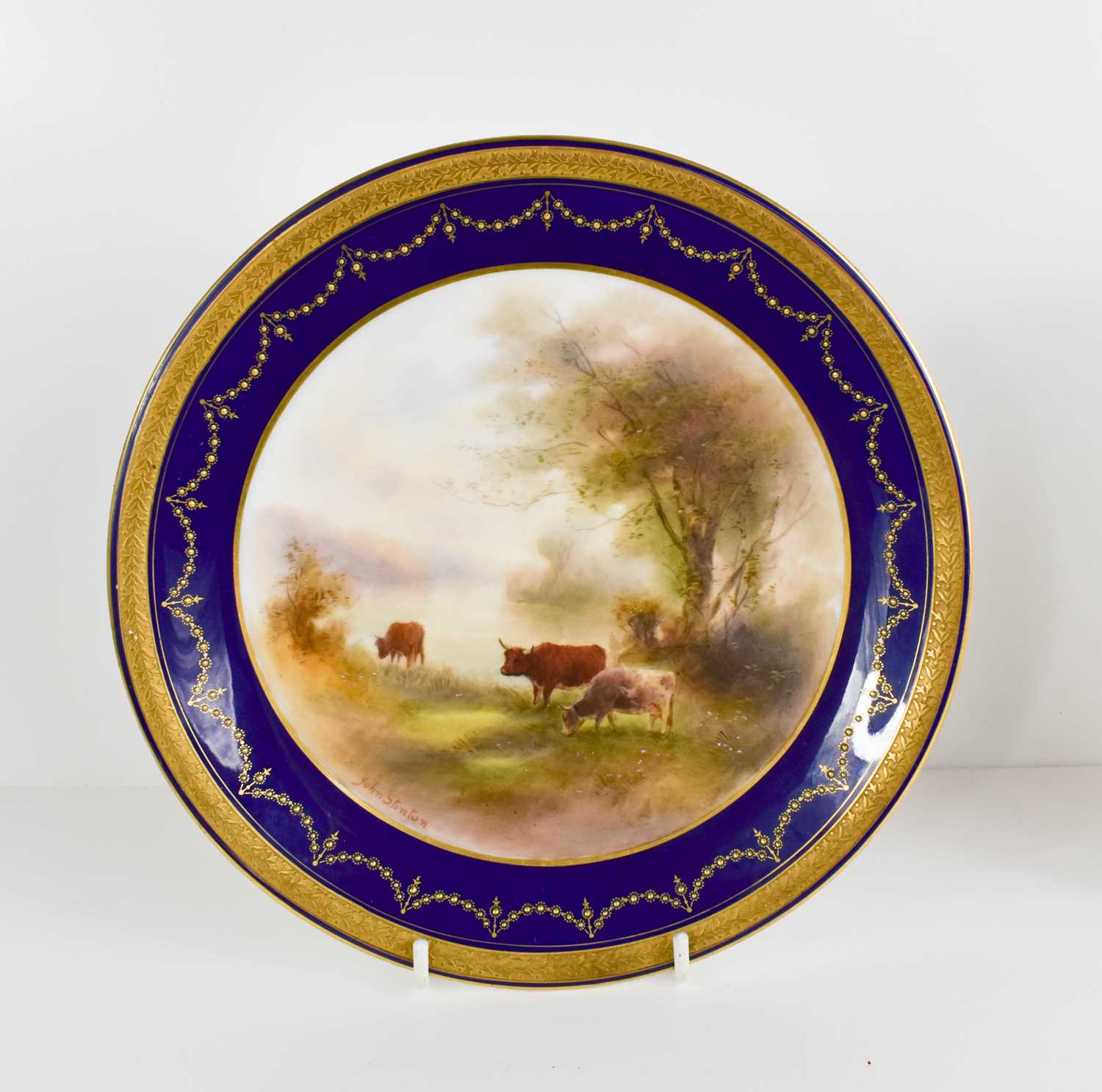 Lot 122 - A Royal Worcester plate painted with lowland...