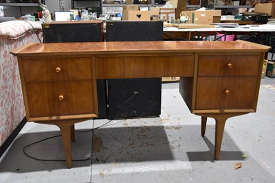 Lot 558 - A Mid-Century teak effect dressing table,...