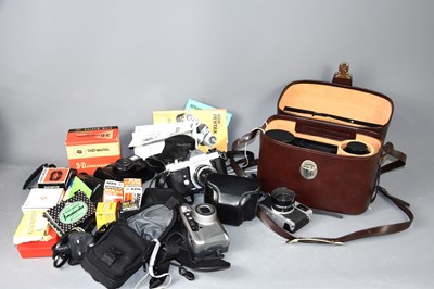 Lot 308 - A group of vintage cameras and lenses to...