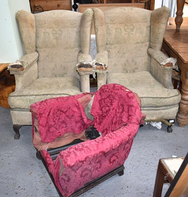 Lot 544 - A pair of Victorian wingback armchairs, raised...