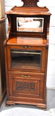 Lot 552 - A 19th century mahogany music cabinet with...