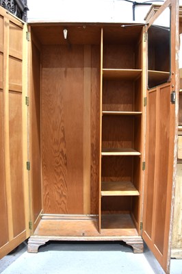 Lot 569 - A vintage 1950s wardrobe with part shelved...