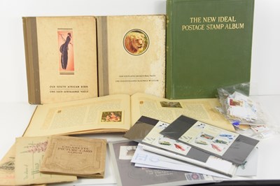 Lot 261 - A group of cigarette card albums and stamps to...