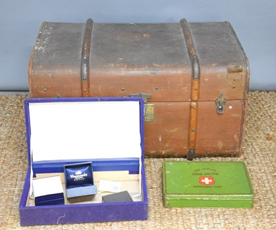 Lot 547 - A vintage leather bound steamer trunk together...