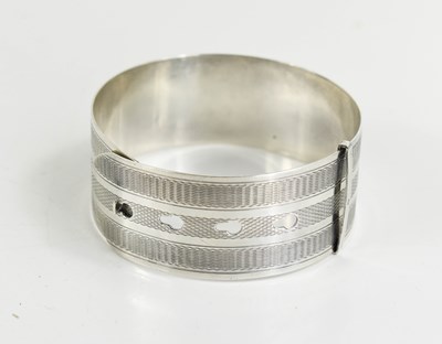 Lot 195 - A Charles Horner silver bangle, engraved with...