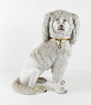 Lot 88 - A 19th century porcelain figure of a poodle,...