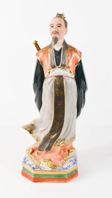Lot 9 - A porcelain figure of a Japanese nobleman,...