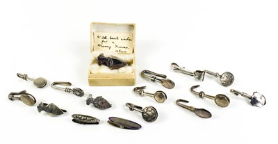 Lot 392 - A collection of fourteen silver napkin clips...