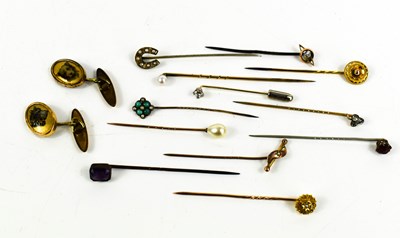 Lot 388 - A group of twelve stick stock pins including...