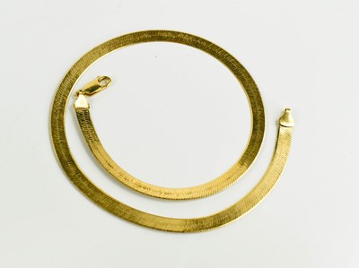 Lot 158 - An 18ct gold herringbone neck chain with Greek...