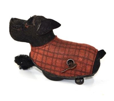 Lot 559 - A vintage Schuco Tippy Terrier wind up dog.