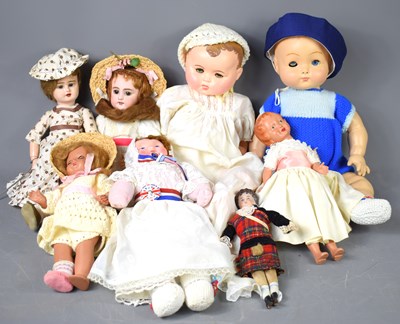 Lot 564 - A group of early 20th century and later dolls...