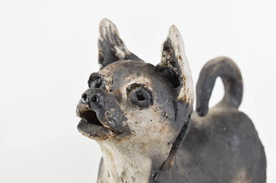 Lot 17 - A clay stoneware sculpture of a standing dog...